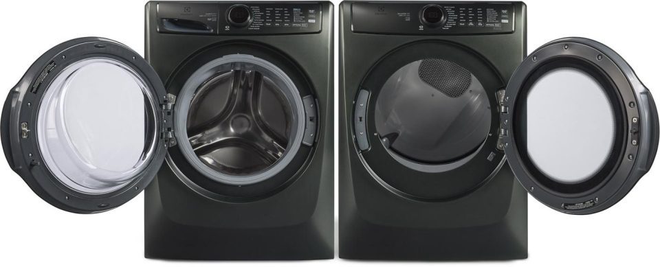 Front-loading washer and dryer set with black exteriors. Both doors are open, revealing the stainless steel interiors. Buttons and dials are visible on the control panels above.