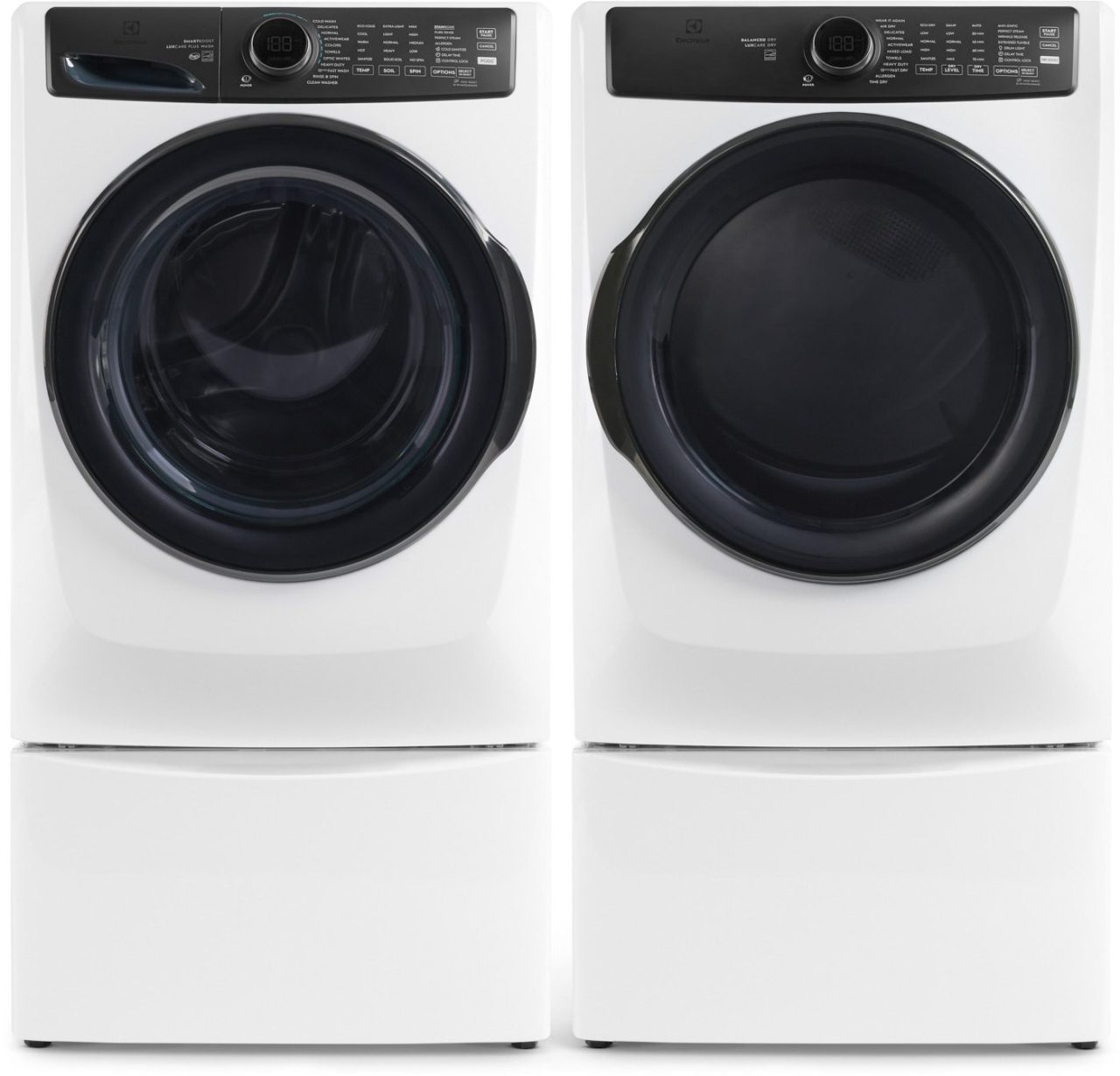 A front-loading washer and dryer set in white, featuring digital displays and multiple control buttons. The appliances are placed side by side, with the dryer on the right.