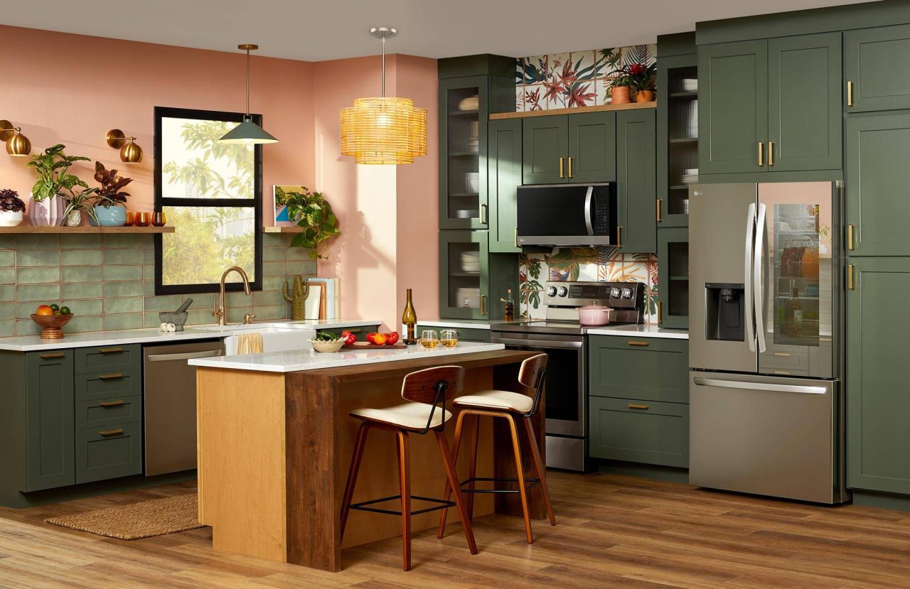 Photograph of elegant kitchen interior with counter island and warm lighting.