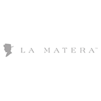 Logo for "La Matera" featuring the brand name in elegant letters and a silhouette of a person wearing a hat on the left. The overall design is minimalist and stylish.