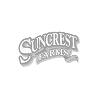 Logo with the text "Suncrest Farms" in bold, stylized font on a black background. A small decorative ribbon element is beneath the word "Farms.