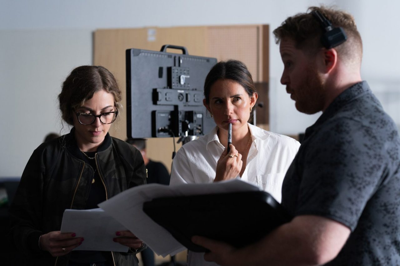 Photograph of a creative team working together thoughtfully on a project in the studio.